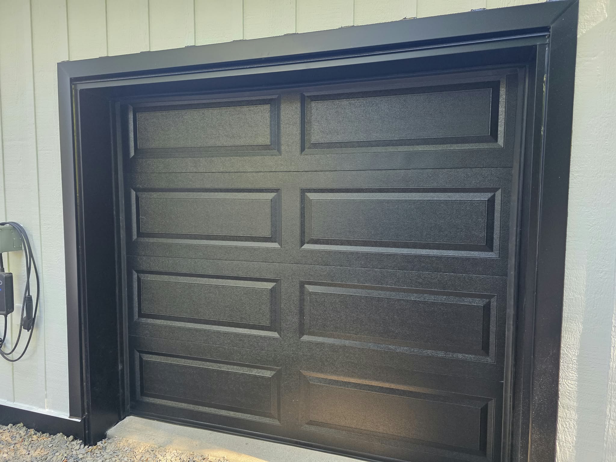 Close-up of a black panelled garage door